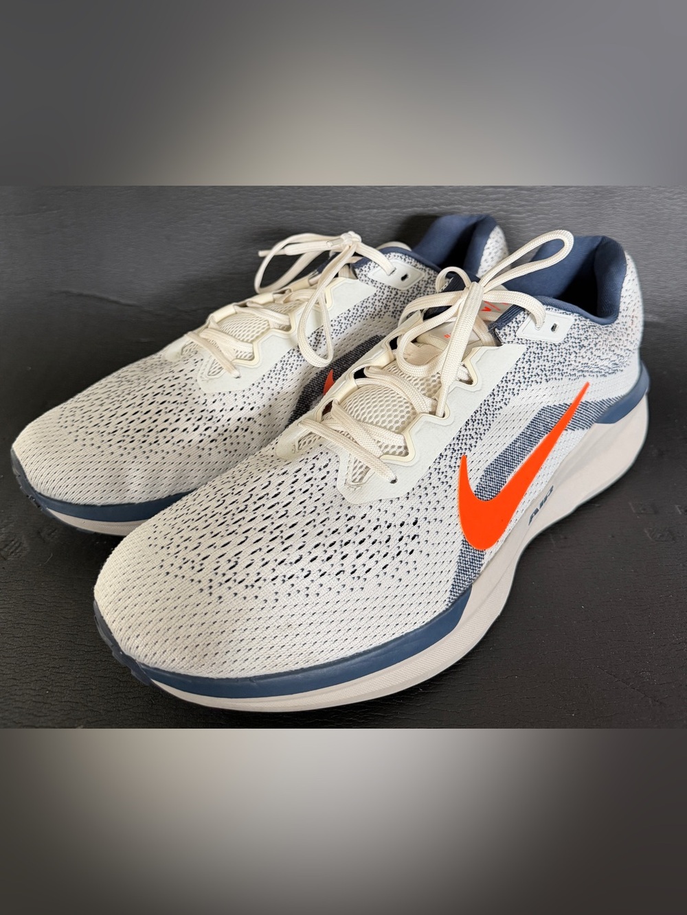Nike Men's Running Shoes in White with Orange Swoosh and Navy Accents
